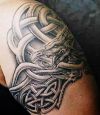 celtic knot dragon arm tattoo